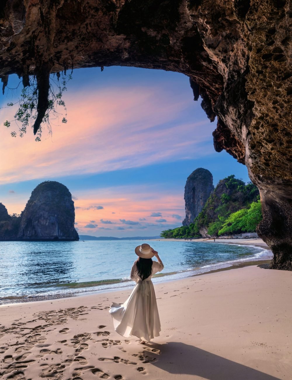 Woman walking on Railay beach, Krabi in Thailand. Woman walking on Railay beach, Krabi in Thailand.